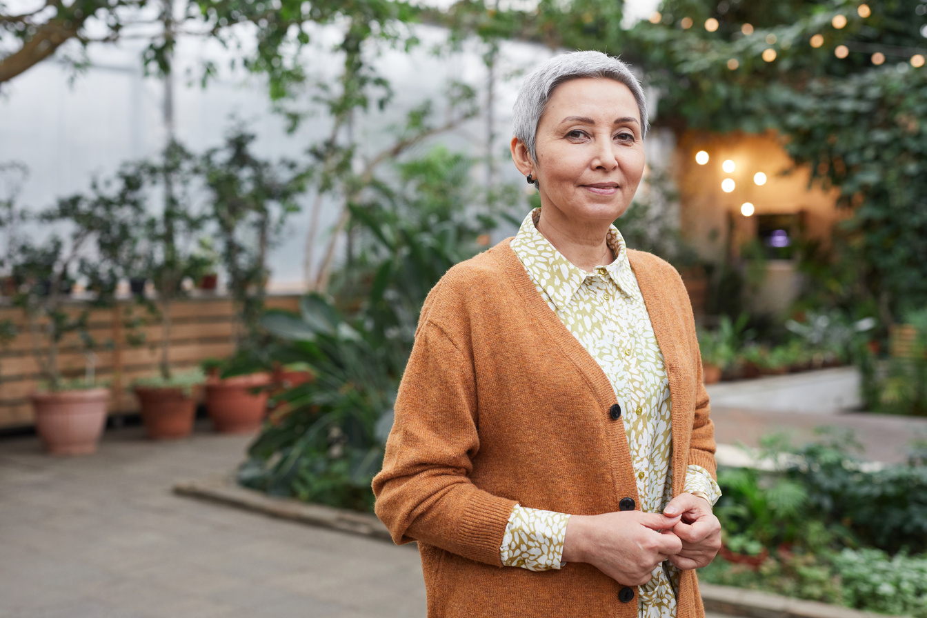 Woman in Brown Sweater Smiling